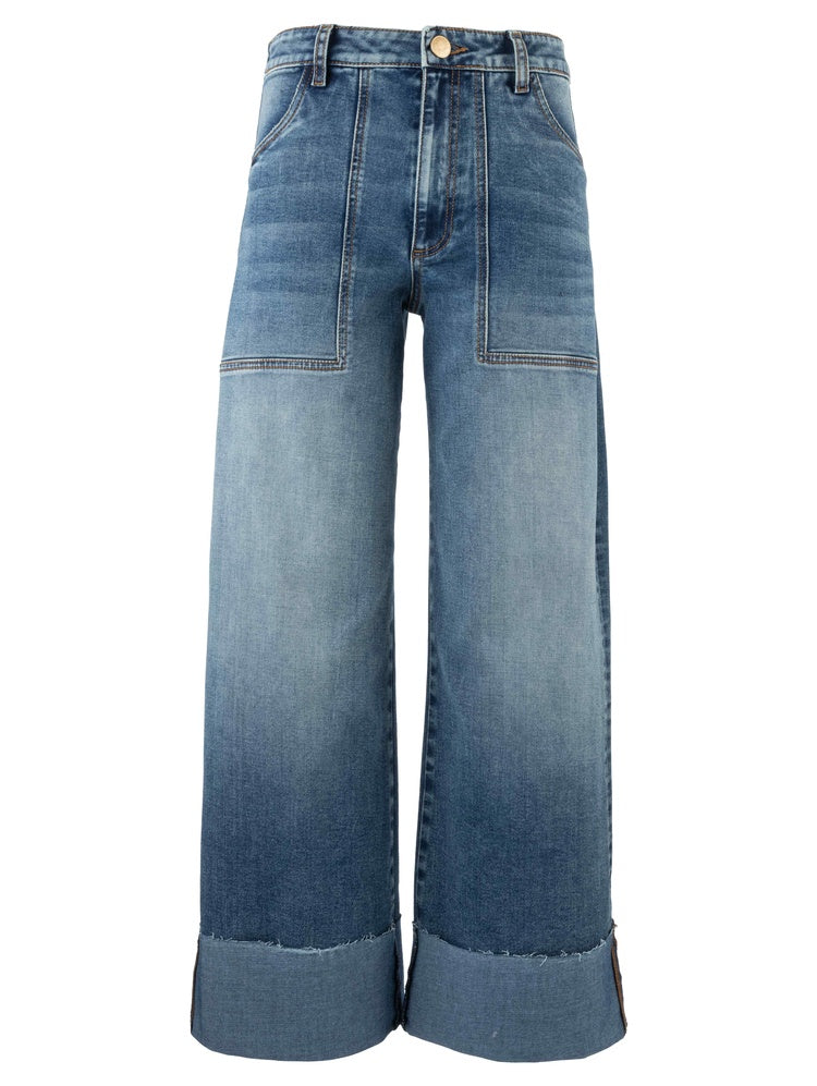 The Zertz MEG HIGH RISE WIDE LES ROLL UP jeans feature a relaxed wide-leg fit, prominent front patch pockets, contrast stitching, large folded cuffs, a slightly faded wash, and a button closure at the high-rise waistband.