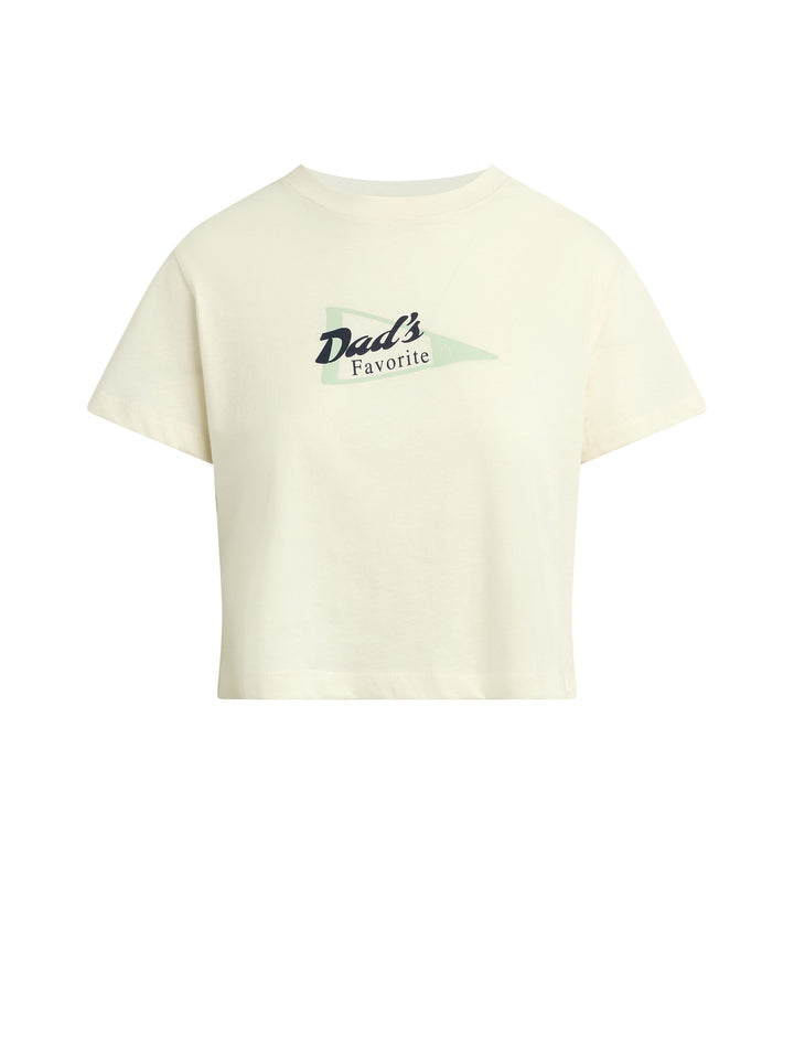 The Zertz CROPPED DADS FAVORITE SPORT TEE is a cream-colored, short-sleeve crop top featuring “Dads Favorite” in black and green over a light green pennant—an easy, classic essential for any dad’s style.