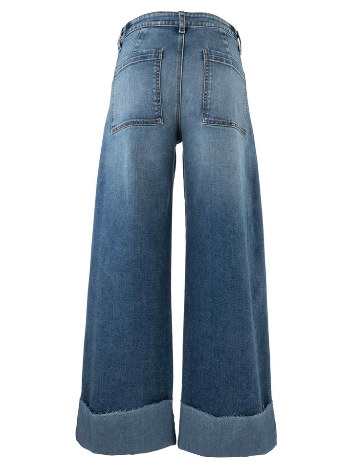 The Zertz MEG HIGH RISE WIDE LES ROLL UP jeans feature a high-rise fit, wide legs, large back pockets, and a frayed roll-up hem for a relaxed look when viewed from the back.