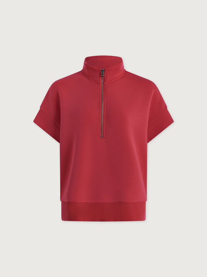 The Zertz RITCHIE SHORT SLEEVE SWEAT in Rich Raspberry features a high collar, front half-zip, and short sleeves—a vibrant pullover top to elevate your casual style. Shown against a plain white background.
