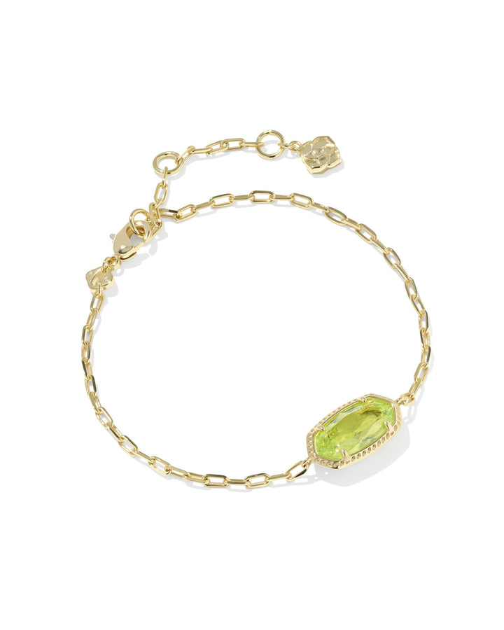 The Zertz ELAINA LUXE CHAIN BRACELET showcases a delicate gold chain, an oval LT GREEN CZ centerpiece, adjustable clasp, and small gold charms—a versatile accessory to elevate your luxury jewelry collection.