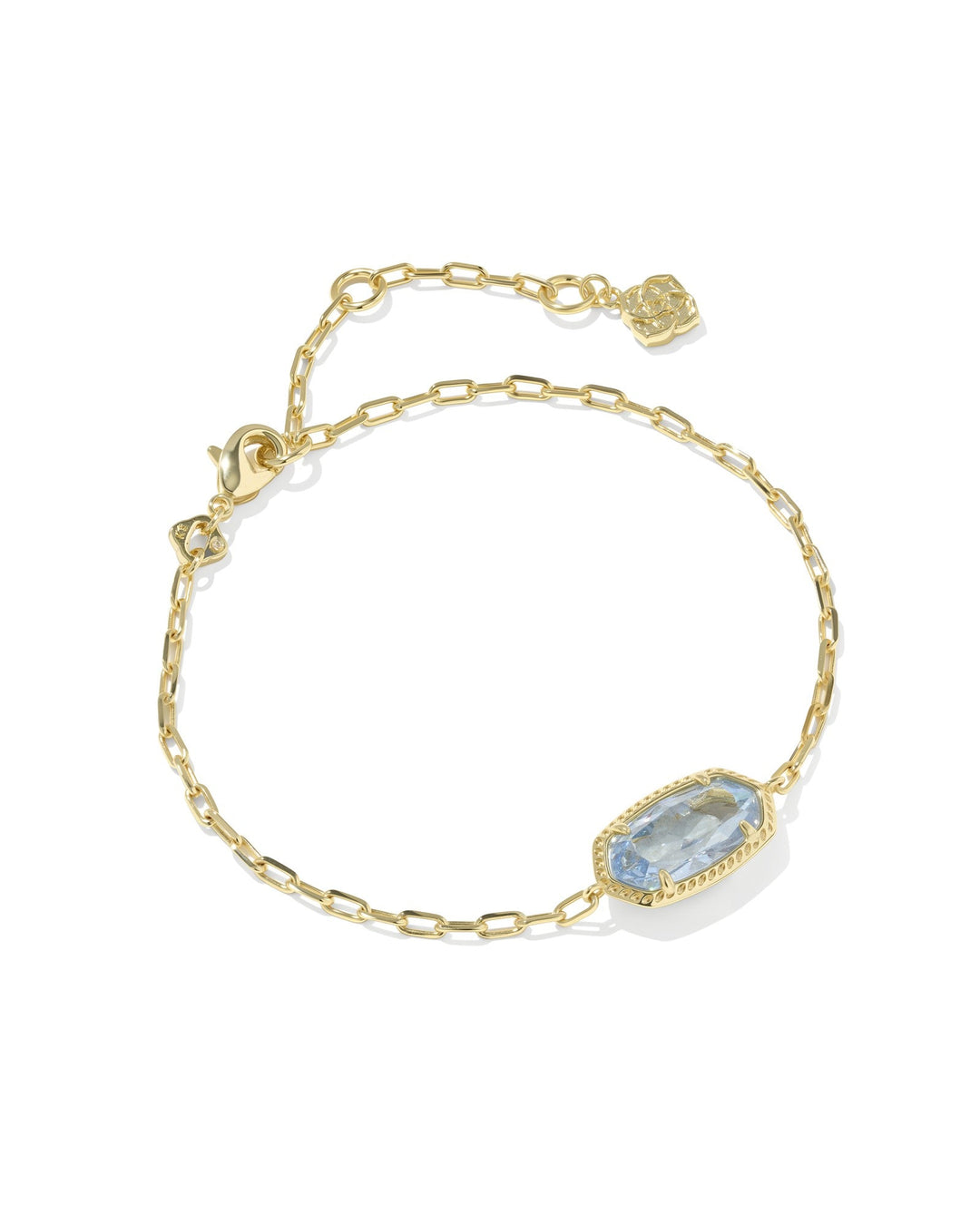 The Zertz ELAINA LUXE CHAIN BRACELET features a delicate gold chain with a LT BLUE CZ rectangular gemstone, an adjustable clasp, and a small charm at the end—a versatile accessory for any occasion.
