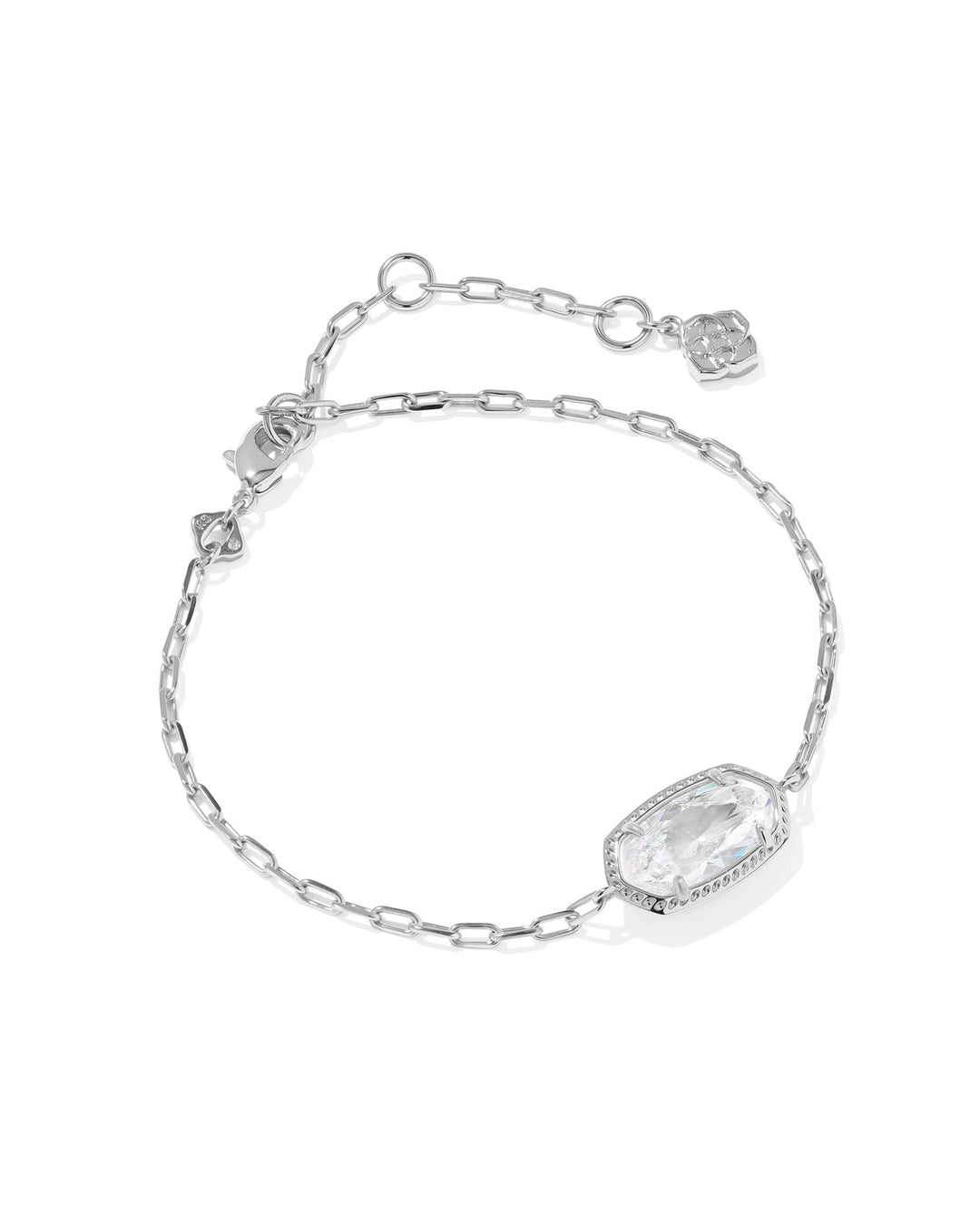 The Zertz ELAINA LUXE CHAIN BRACELET features a delicate silver chain, adjustable fit, and an oval faceted WHITE CZ gemstone in a bezel. A small charm accents the end, making it a versatile luxury accessory. Displayed on a white background.