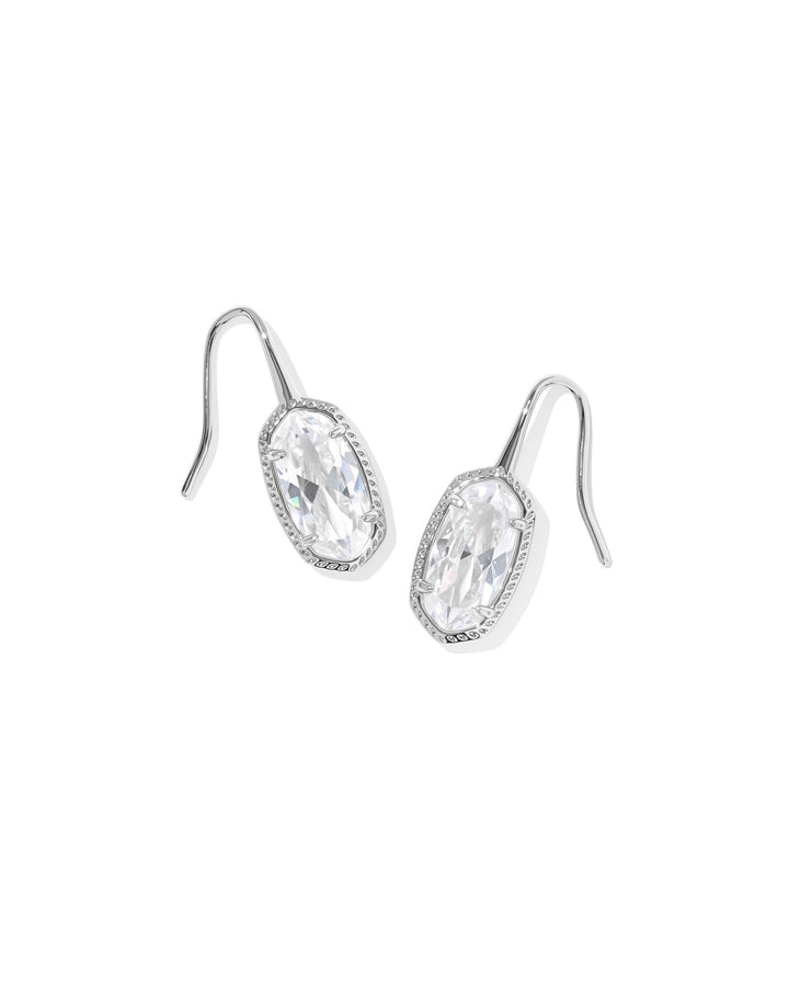 The Zertz LEE LUXE DROP EARRING features elegant silver drops with oval WHITE CZ stones bordered delicately, showcased on a white background.