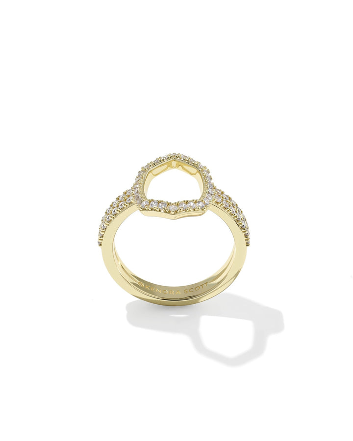The DAPHNE PAVE COCKTAIL RING by Zertz is a gold ring with a unique open oval design, featuring pavé-set sparkling diamonds along the band and oval, shown against a white background.