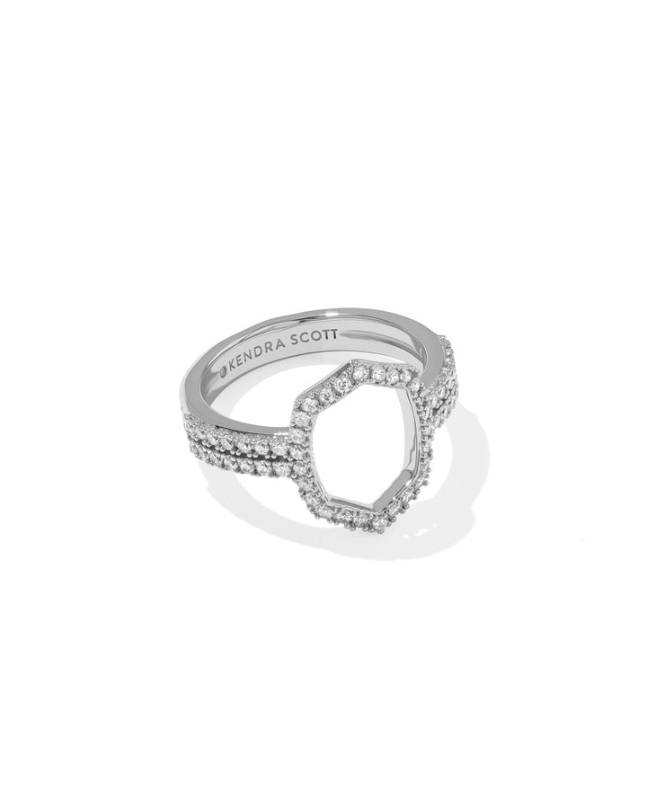 The Zertz DAPHNE PAVE COCKTAIL RING is a silver double-band ring with pavé details and small white gemstones, highlighted by an open irregular hexagon at the center. The inner band features an engraved Zertz logo.