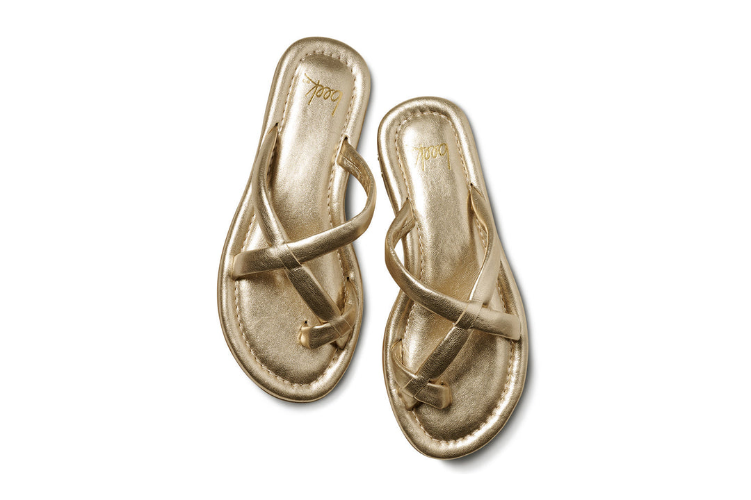 A pair of Zertz SUNGEM SANDAL metallic gold sandals with crisscross straps, shown from above on a white background—ideal as comfortable and stylish summer footwear.