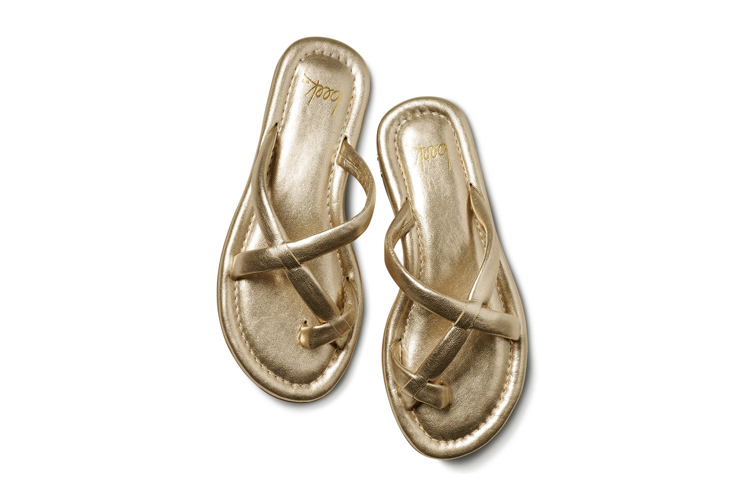A pair of Zertz SUNGEM SANDAL metallic gold sandals with crisscross straps, shown from above on a white background—ideal as comfortable and stylish summer footwear.