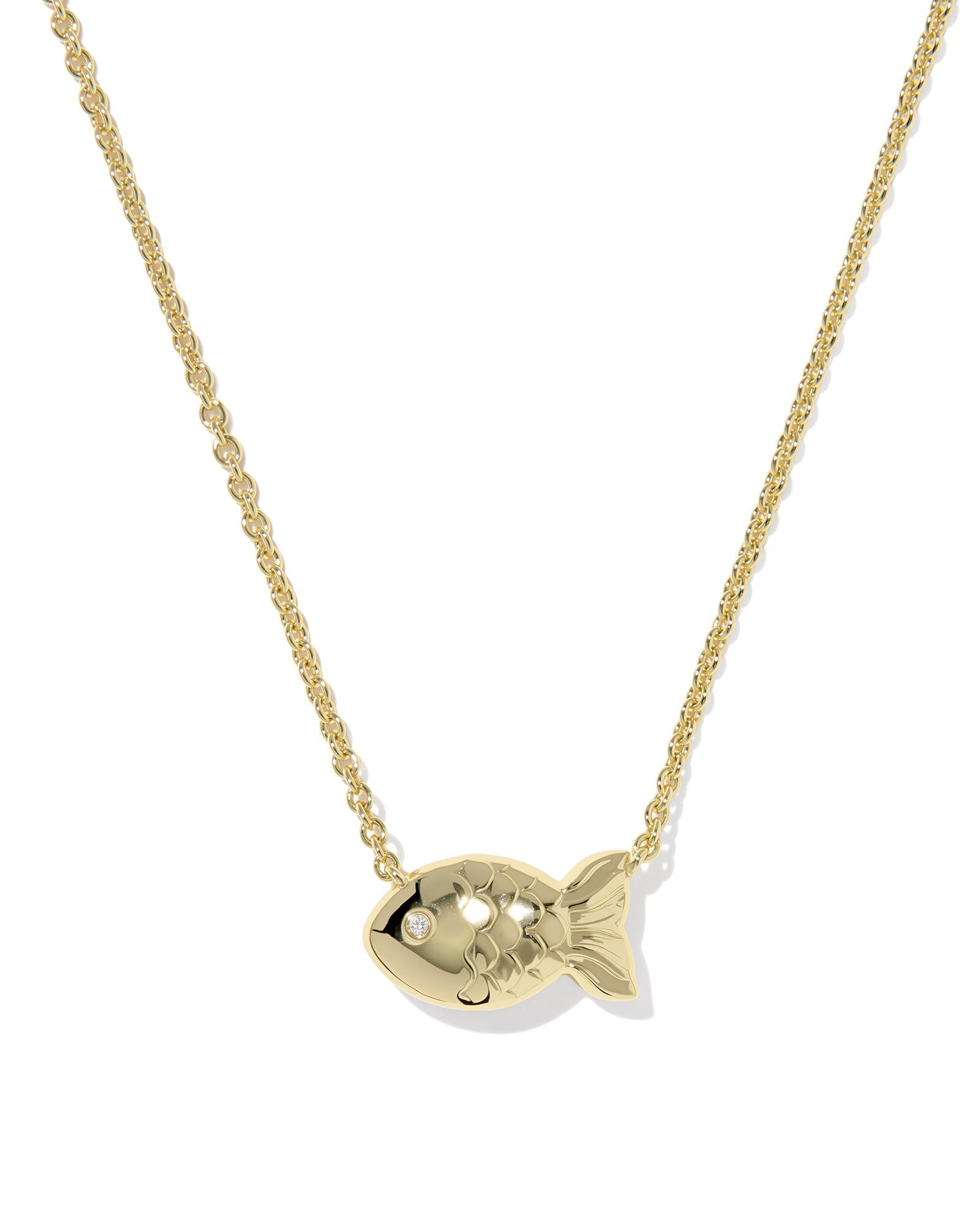 The Zertz PARKER FISH NECKLACE is a gold piece with a fish-shaped pendant featuring a gemstone eye. Its shiny finish and detailed scales make this nautical necklace perfect coastal-inspired jewelry.