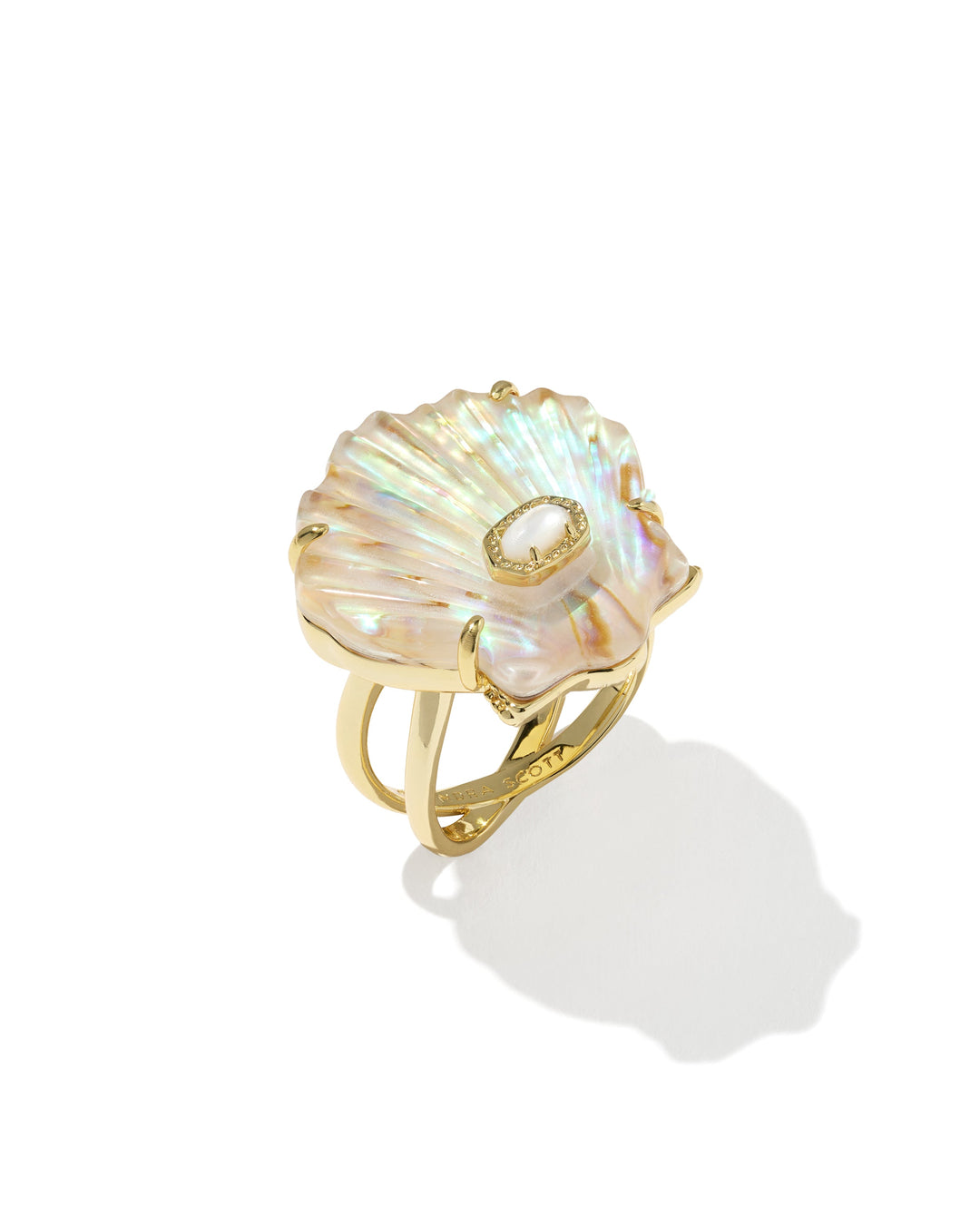The LUCIA SHELL CCKTL RING by Zertz features an iridescent gold, shell-shaped design with a small oval gemstone center, shown on a white background—a striking piece of coastal jewelry.
