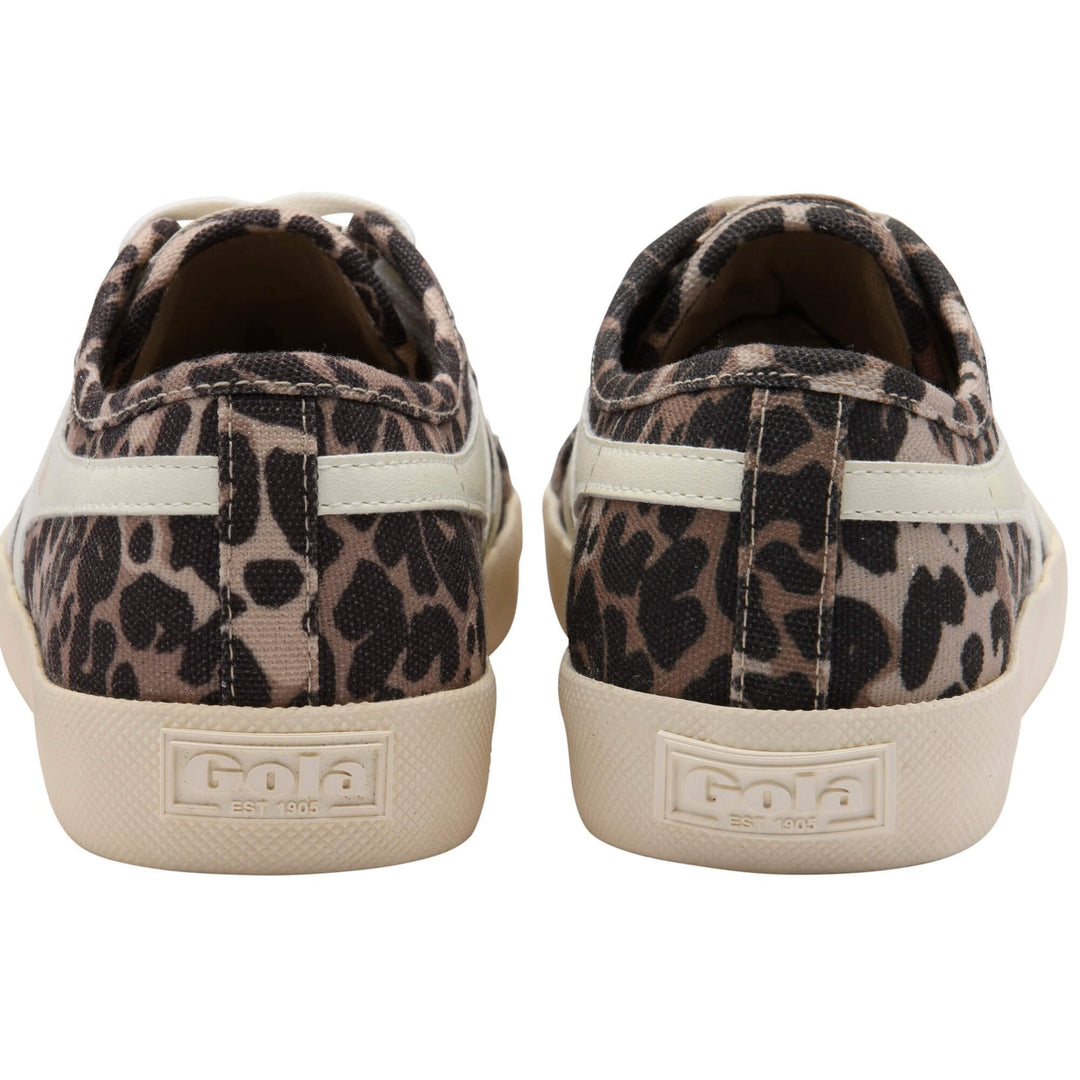 A pair of Zertz COASTER LEOPARD TRAINER women’s sneakers with a beige and black leopard print, shown from the back. These retro-style canvas shoes feature cream rubber soles with embossed Zertz branding on the heel.